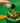 An image of a hand holding a bottle of Classic Herb SaladSprinkles, sprinkling them over a delicious green salad.