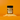 A bottle of Maple Sea Salt SaladSprinkles nestled in a little pile of salad sprinkles on an orange background.