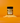 A bottle of Maple Sea Salt SaladSprinkles nestled in a little pile of salad sprinkles on an orange background.
